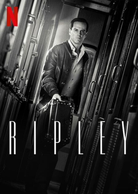 A black and white poster for the Netflix series "Ripley." Andrew Scott, as the title character, stands in a narrow train corridor holding a suitcase and looking on with an intense expression.