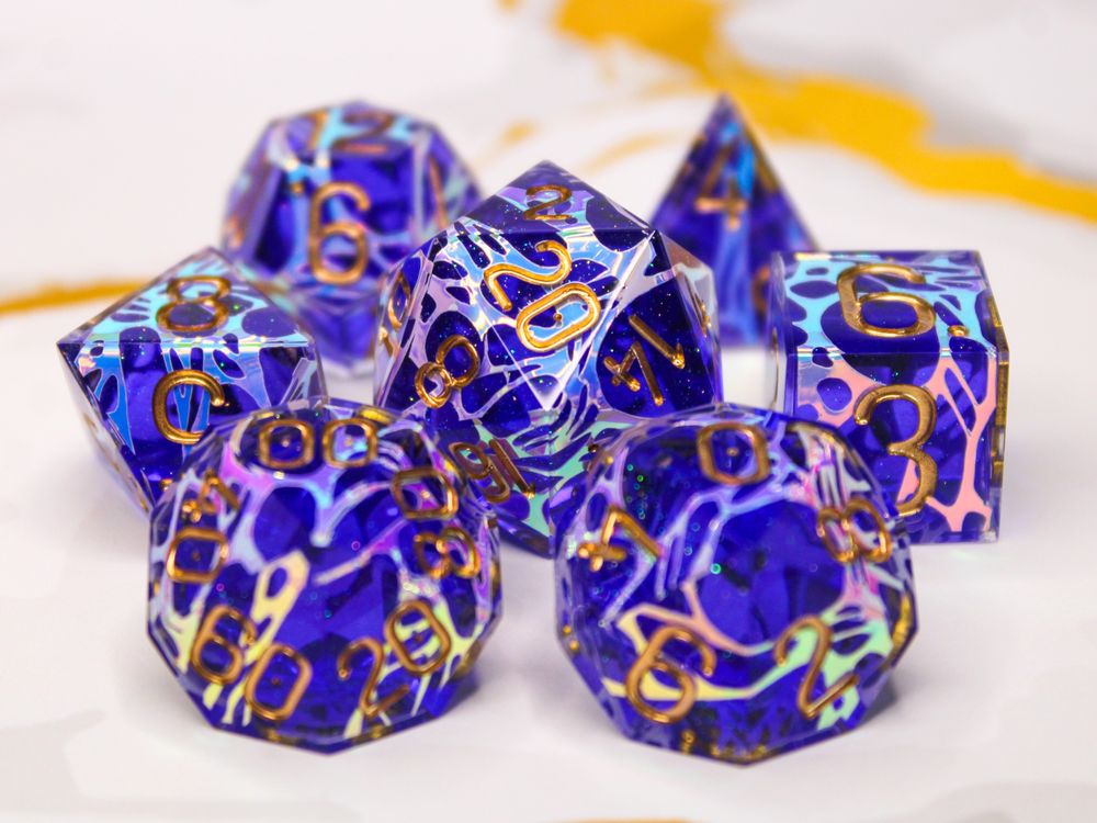 A dice set inspired by Viktor from Arcane. Purple with iridescent patterns and gold numbers.