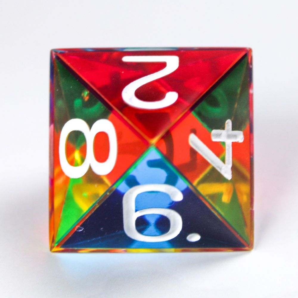 A photograph of an 8 sided dice. Each side is coloured either cyan, magenta or yellow which combine into a full rainbow spectrum of colour.