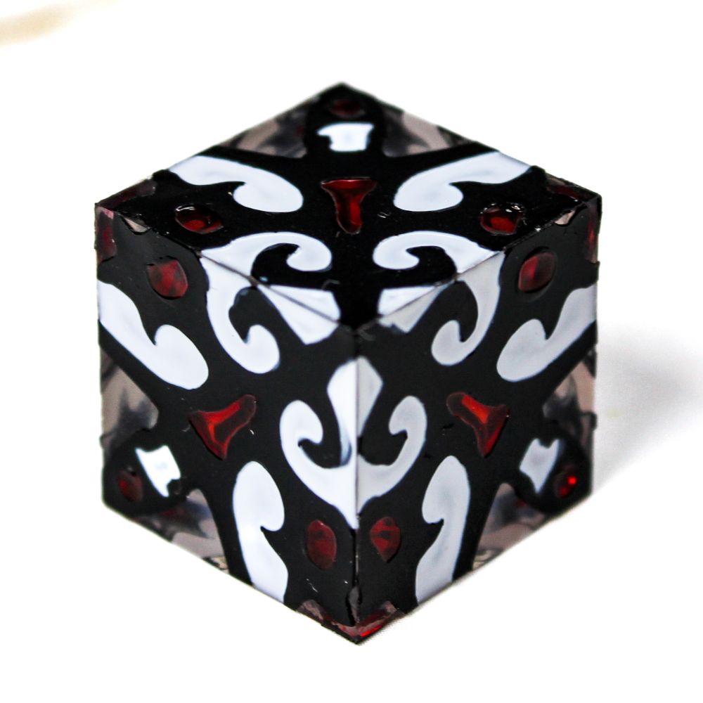A d6 with a slightly gothic design in black, white and blood red.