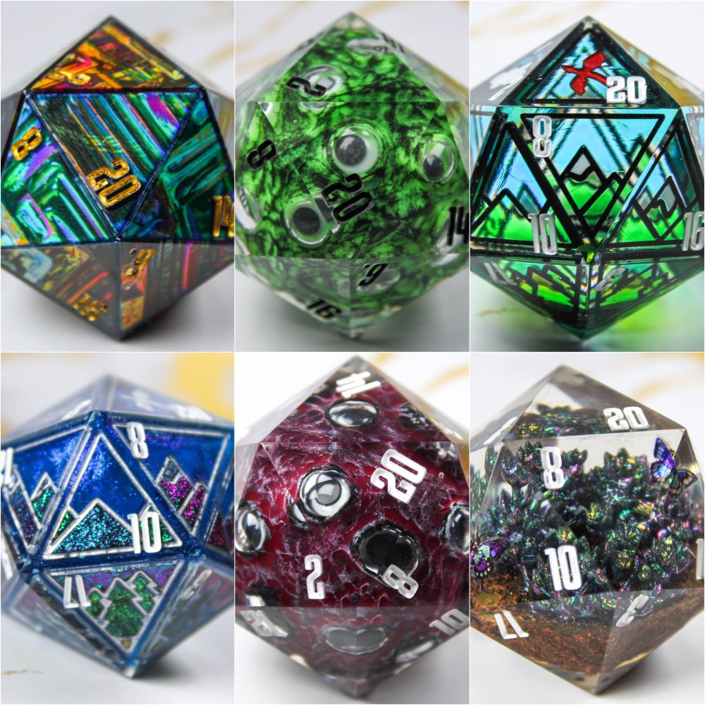 A composite photo of multiple d20s. One has a rainbow bismuth design. Two are mountain landscapes one with a stained glass effect to it and one with a colourshifting effect. Another d20 is a little garden scene with succulent plants and butterflies. And the last two d20s are inspired by the Magnus Archives entity "the eye" and have multiple googly eyes that stare out at you.