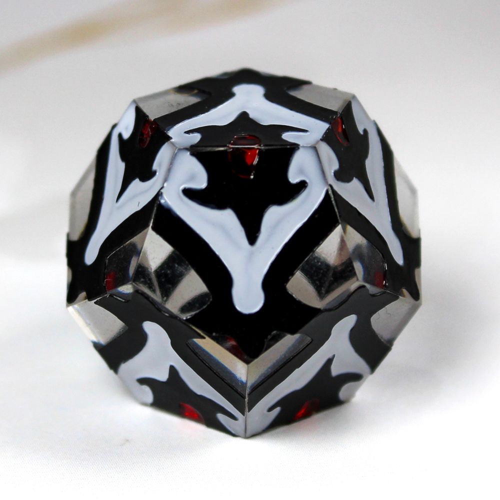 A d12 with a slightly gothic design in black, white and blood red.