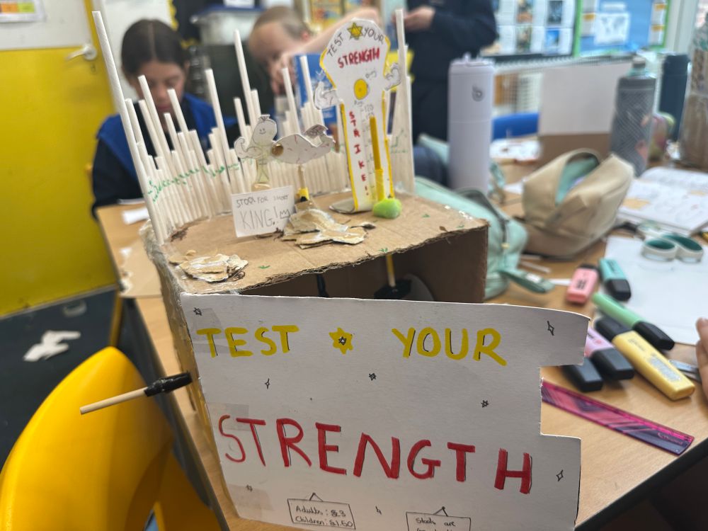Daisy has made a carnival game of test your strength where the hammer falls and the indicator rises