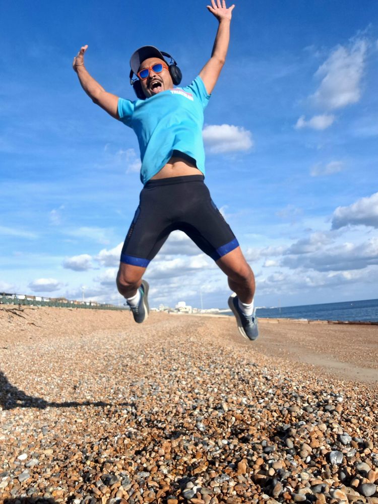 Selfie of me in mid-air jumping on Hove seafront 