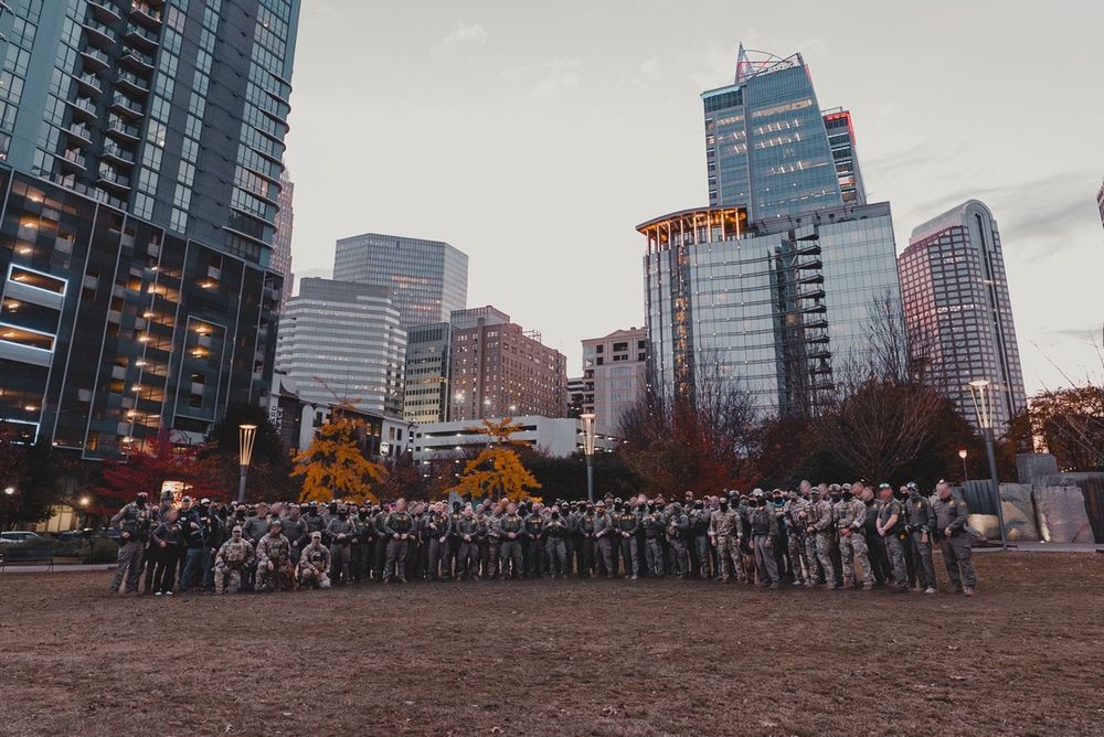 A field of CPB and ICE thugs posing in Charlotte, NC before going on to abuse residents.
