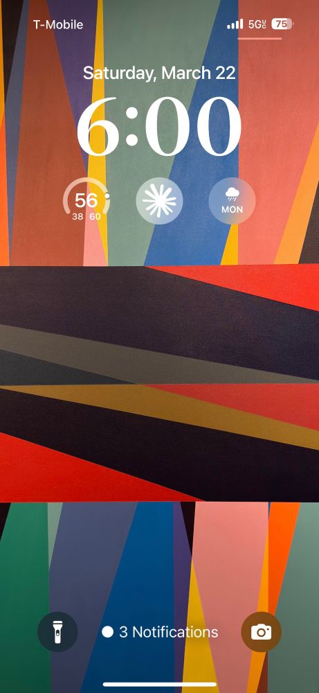 Screenshot of an iPhone Lock Screen with a weather widget, Claude widget, and rain widget. 