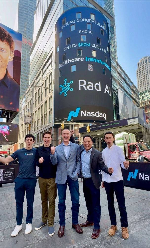 Josh Duncan, John Paulett, and Bill pose in front of the NASDAQ sign in NYC celebrating the Rad AI Series B raise