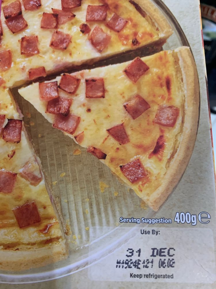 Ready to eat quiche box with use by date of 31 December, photo taken on 2 January.