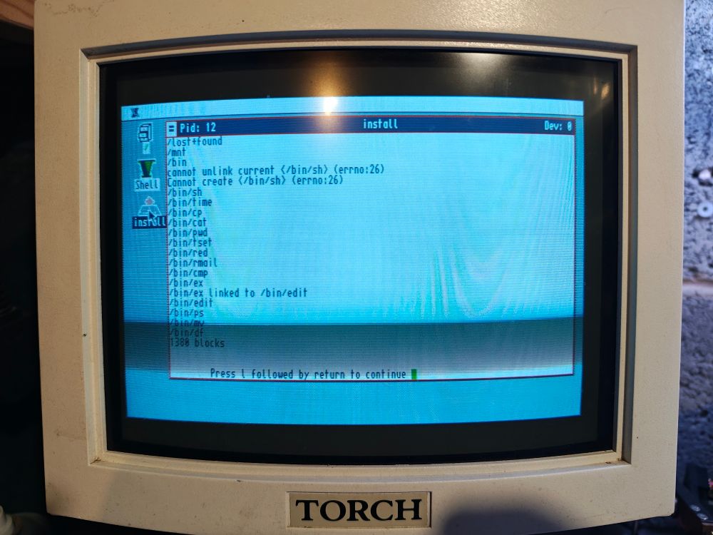 The Torch Triple X display showing the console output following completion of installing disk 2. Only 13 more to go...
