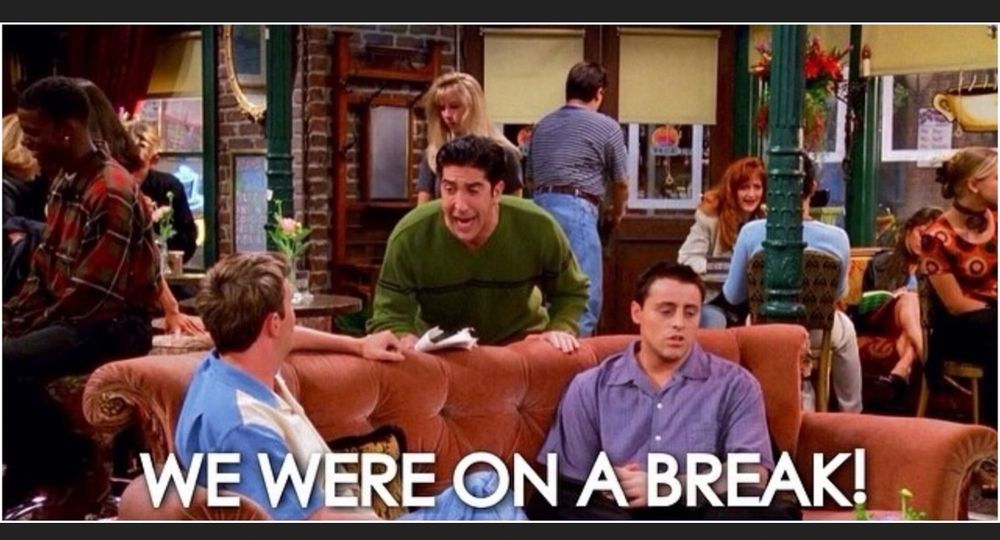 A shot of the male TV "Friends" at Central Perk with the caption of Ross hollering "We were on a break!"