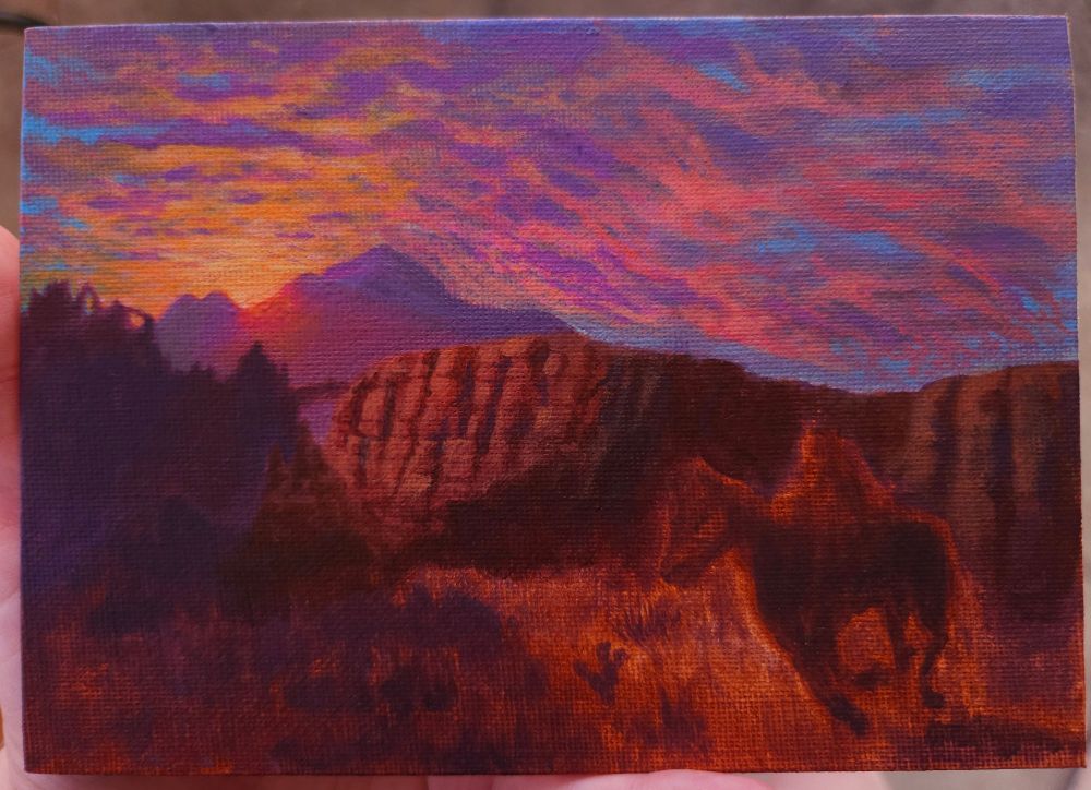 unfinished painting of a horse and rider in the desert, a red Mesa is illuminated by the twilight sun and rock arches are silhouettes in the distance, as the sunrays shine brightly between distant mountain peaks, lighting up the scattered clouds in orange, pink, and violet 

the painting's foreground is only a loosely realized sketch, with more detail in the sky and background. all 4 images are the same painting with variation of how the painting was lit when the photo was taken 