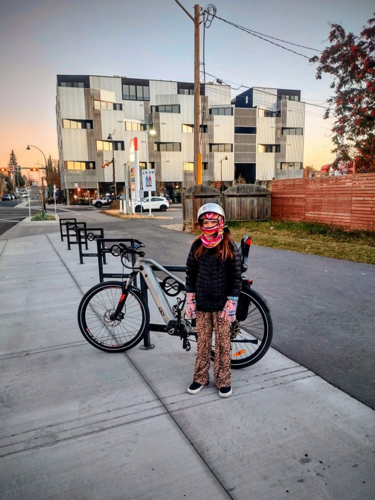 8-year-old child standing there recently completed bike lane in Marda loop