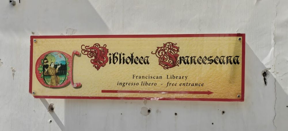 Sign reading 'Biblioteca Francescana: Francescan Library'