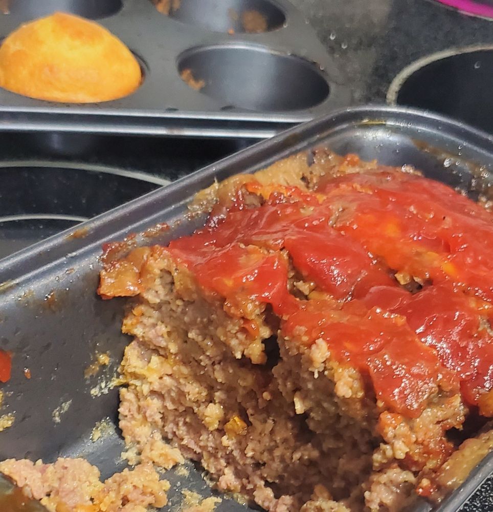 Traditional meatloaf, stuffed with breadcrumbs and authentic cheese, using a glaze of brown sugared ketchup, with Jiffy corn muffins that I did extra improvizations with like honey, sour cream, etc.