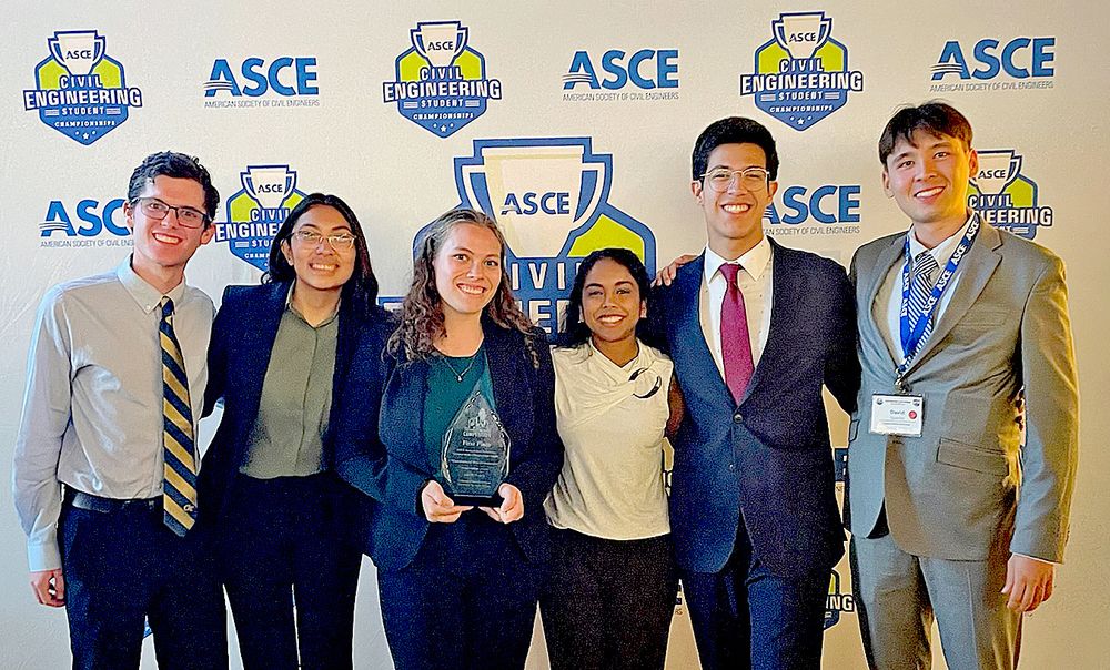 Six members of the first-place Sustainable Solutions team from Georgia Tech with their award trophy.