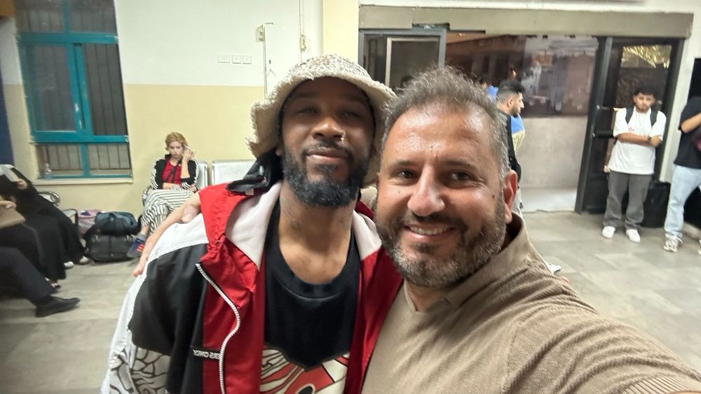 A photo of Chris Smalls post-release from Givon Prison and Isr*el with Anas from Amman, a member of the Freedom Flotilla team—he was part of the 2010 Mavi Marmara Flotilla and their land team in Italy.