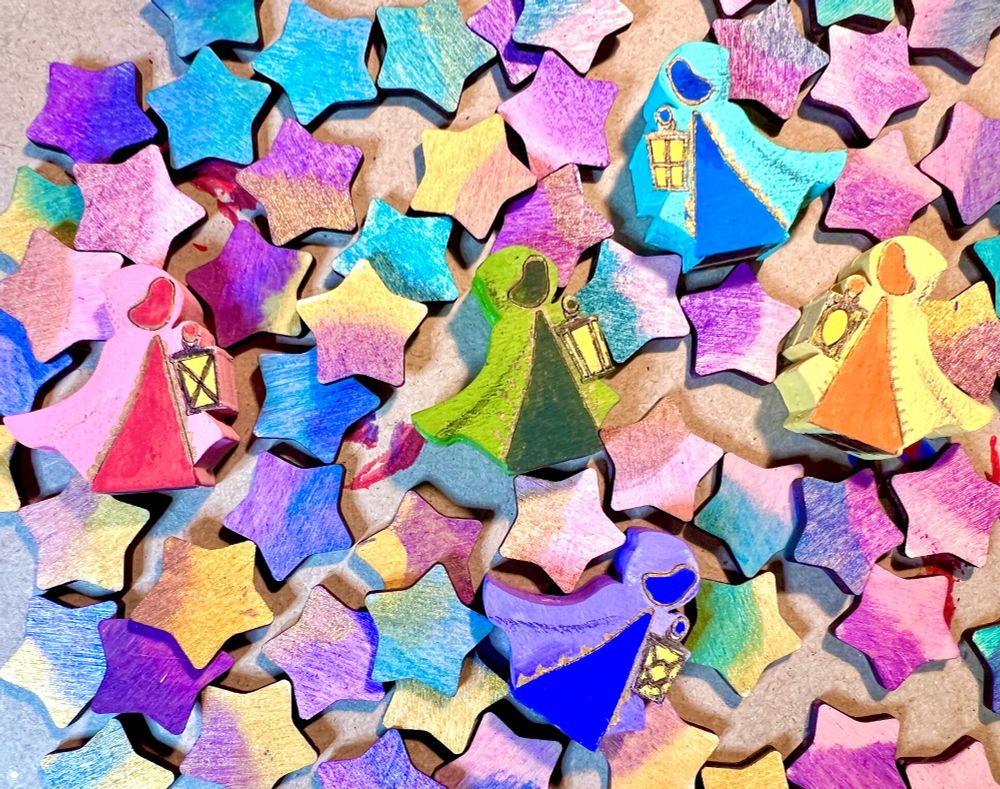 Hand painted stars and  player pawns of cloaked figures