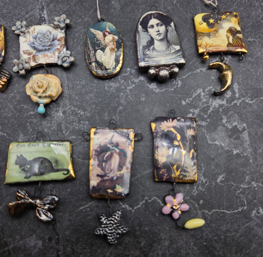 Seven more pendants including witches and cats.
