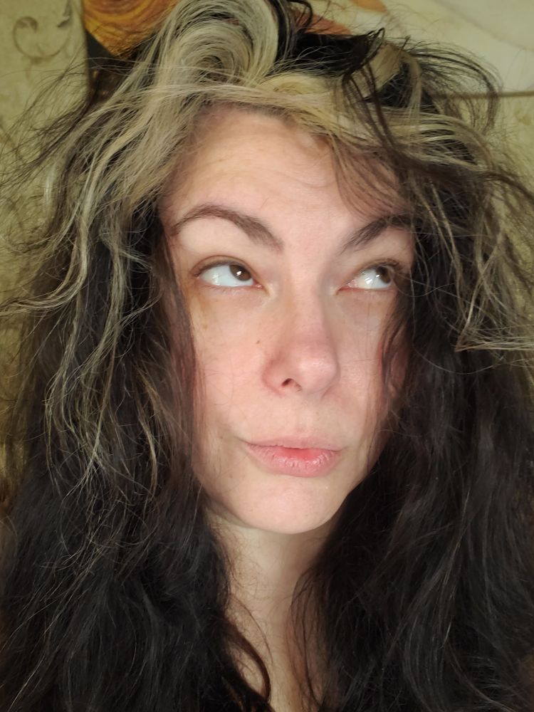 White femme. Black hair with white stripe. Large hair.