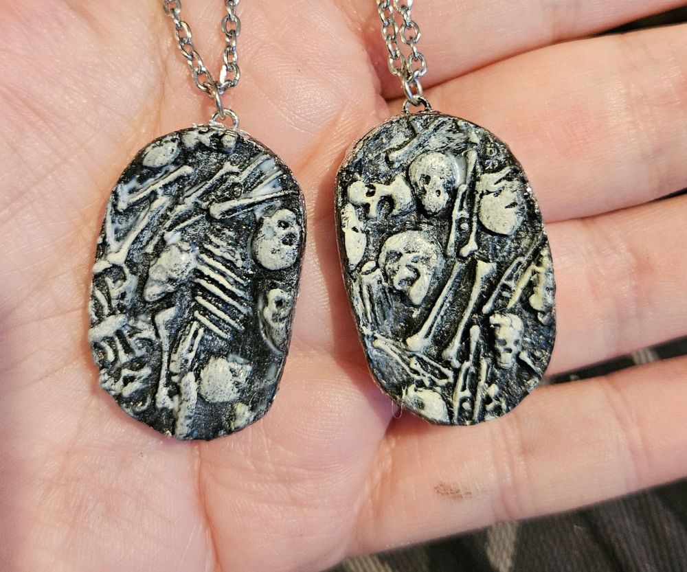 Pendants of bone piles handpainted.