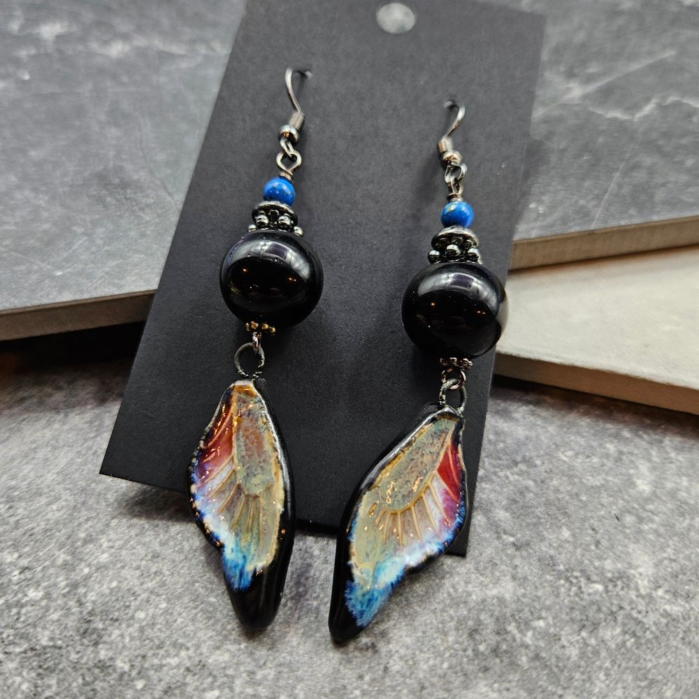 Ceramic butterfly wing earrings with onyx and dyed shell.