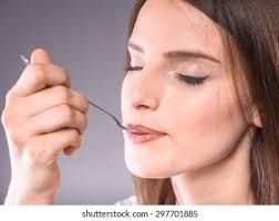 stock image of woman eating from a spoon (one spoonful of neutron star material has about the same mass of mount everest)