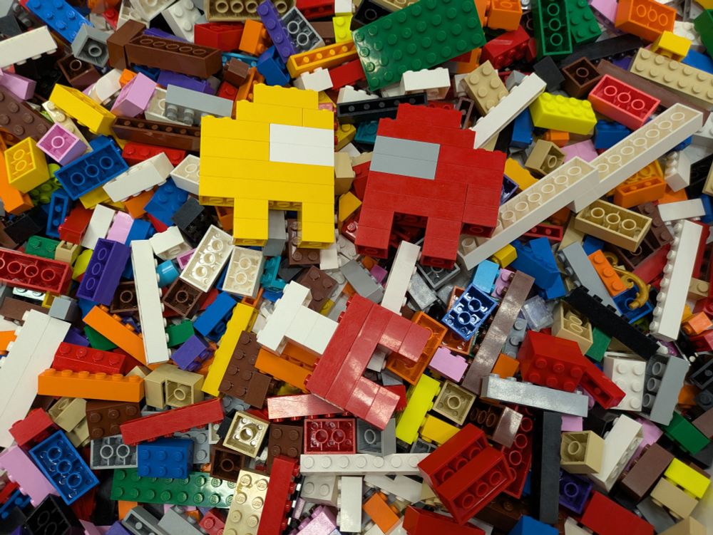 a legos bin at the mall intended for kids to play with while their parents shop. we made 2 amonguses looking over a 3rd, dead amongus with a single ham bone sticking out. I hope some kid finds it and gets a kick out of it
