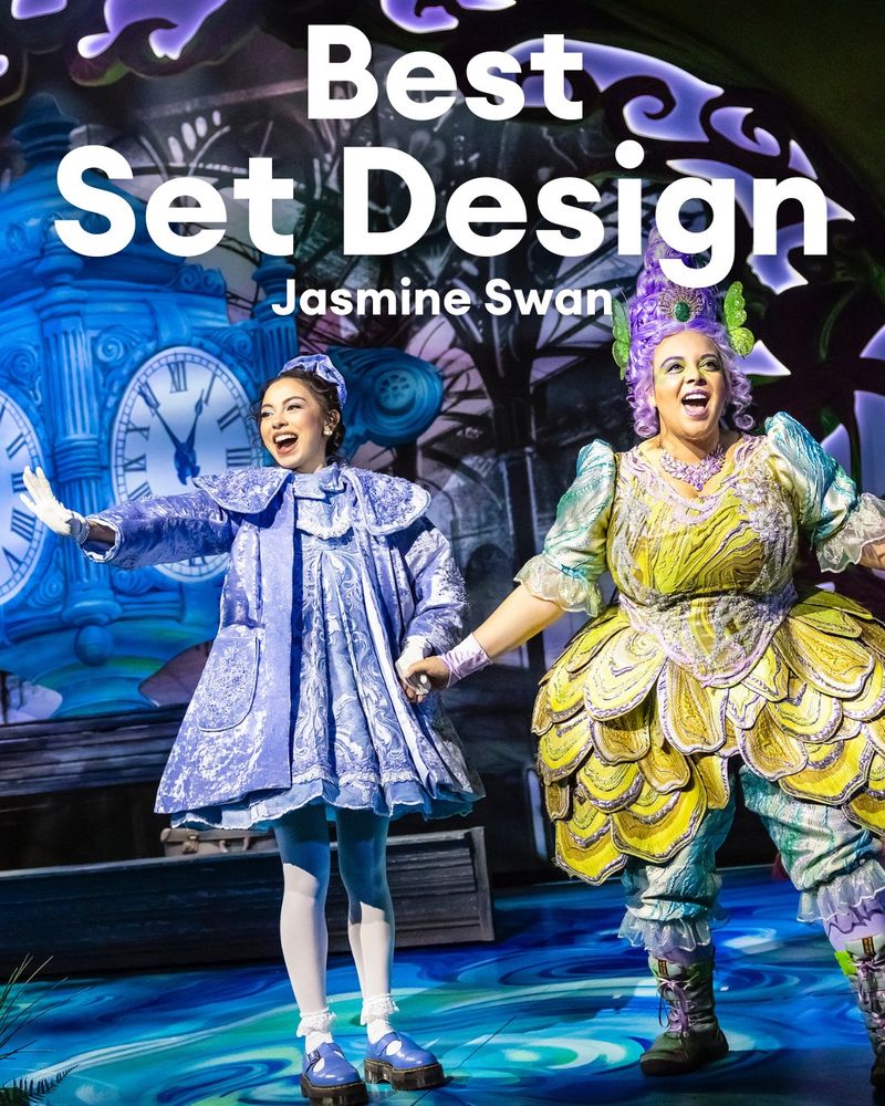 An image of Alexandra Barredo as Wendy and Sasha Latoya as Tinkerbell with a train station set behind them, and the text "Best Set Design Jasmine Swan"