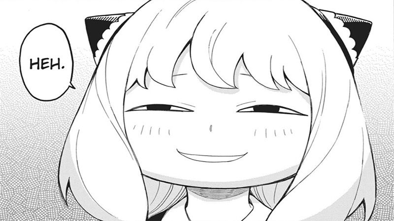 Un extrait du manga Spy x Family où l'on voit son héroïne, Anya, sourire avec un petit air à la fois satisfait et moqueur.