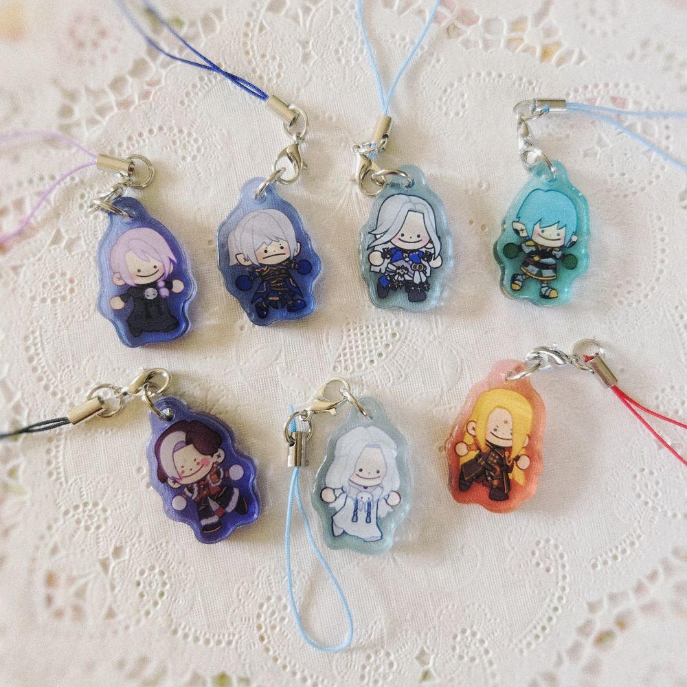 Acrylic charms of the fictional characters from Final Fantasy 14.

From left to right on the top row are: Hythlodaeus, Estinien, Ysayle, and Haurchefant.

From left to right on the bottom row are: Emer-Selch, Venat, and Zenos.