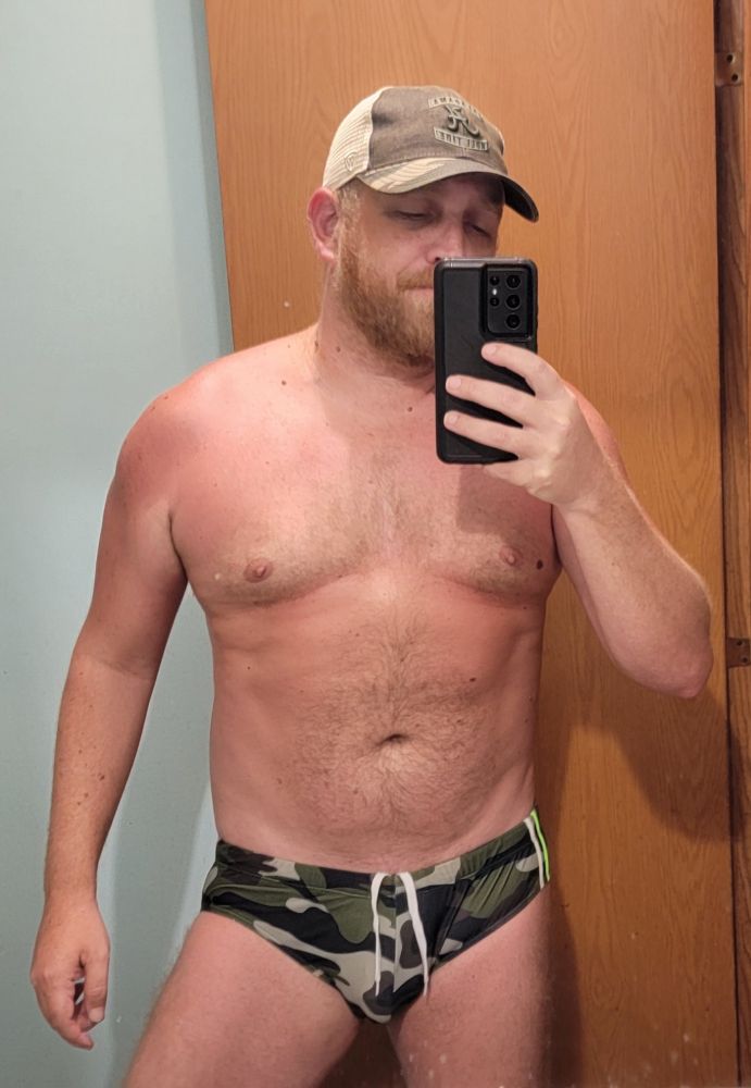 Guy in a camo swimsuit.