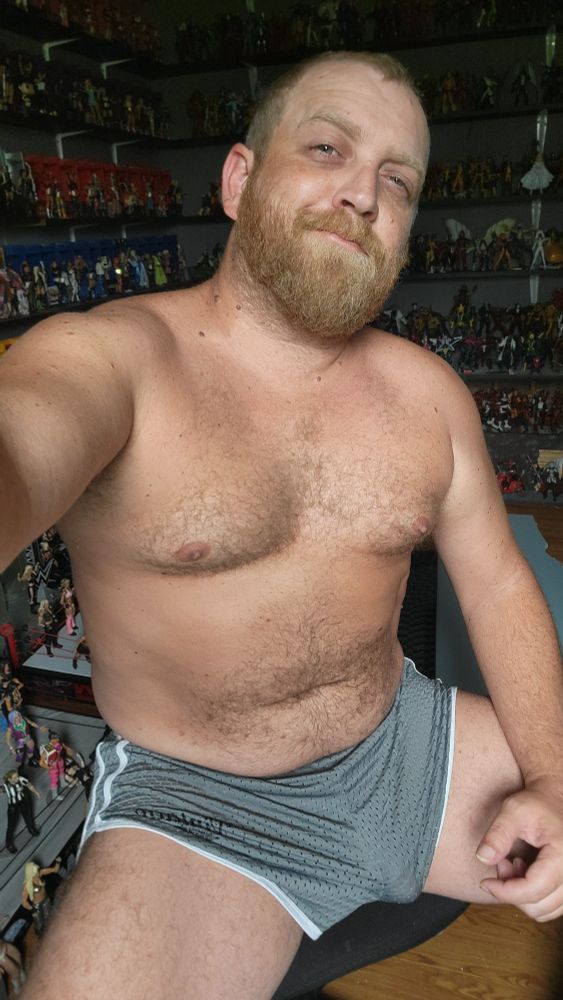 Shirtless guy in short shorts