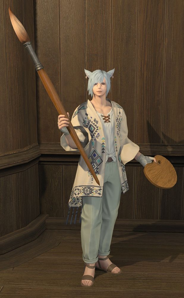 an in-game screenshot reference of the character from the first slide. he's a young adult miqo'te (cat boy), keeper of the moon, with medium length, light blue hair and pink eyes. he appears idling in his pictomancer gear/glamour, with his paintbrush and palette at the ready.