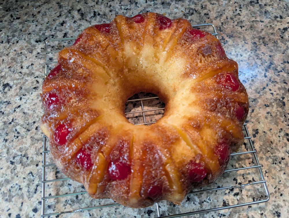 Pineapple upside-down Bundt cake, successfully inverted and cooling on wire rack