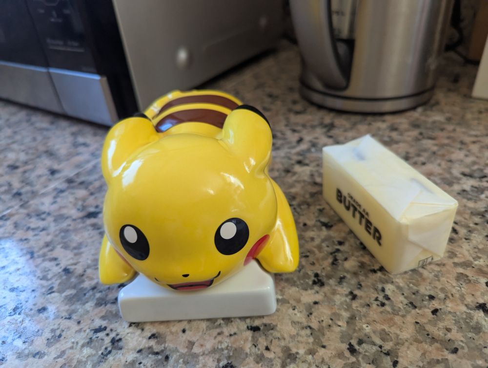 Pikachu butter dish with Western Stubby butter stick for scale