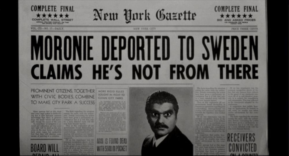 Newspaper with heading “Moronie deported to Sweden. Claims he’s not from there”. From the film “Johnny Dangerously. 