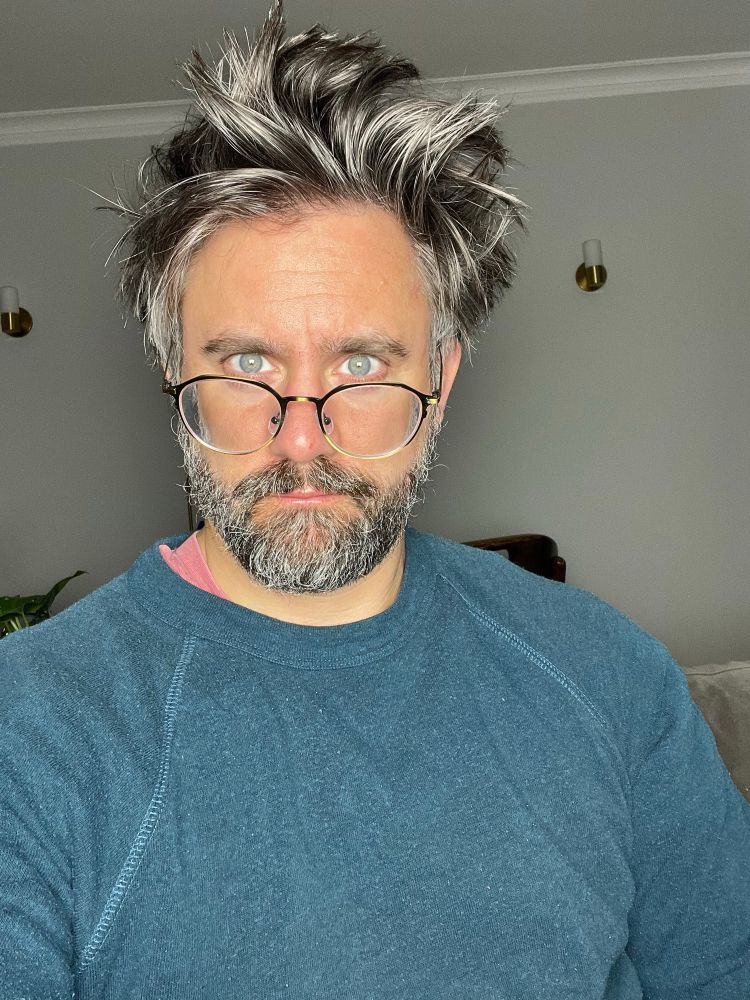 Me staring into a bright light with my glasses down the end of my nose 