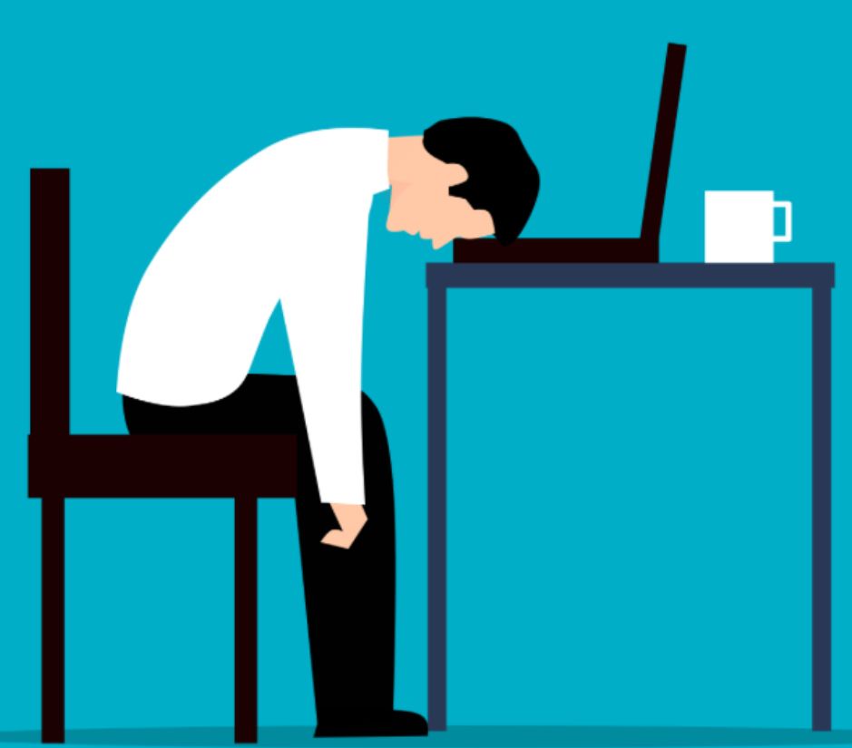 An illustration of a person slumped over with their head on the keyboard of their laptop on the desk. 