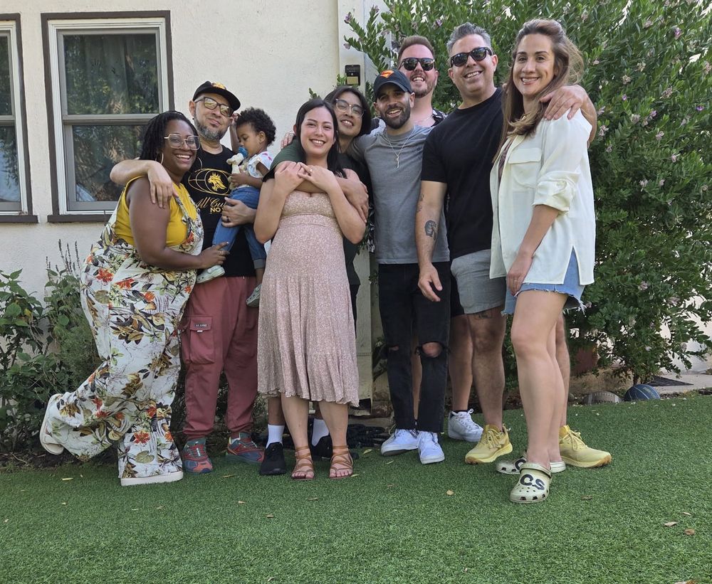 Group of friends cheesin in a LA backyard 