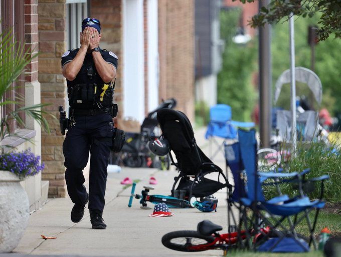 Policeman cries after a mass shooting.