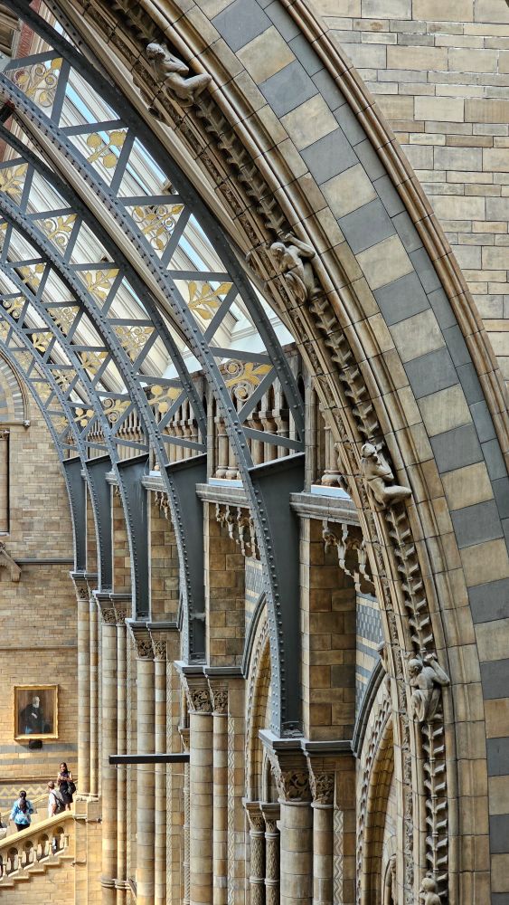 Steel arches holding up alternating tan and green tiles.