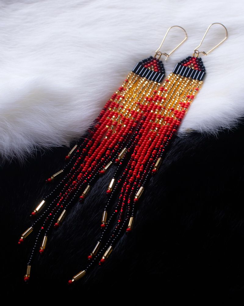 Good, Red, Black beaded fringe earrings. On a white top and black bottom rabbit fur backdrop.