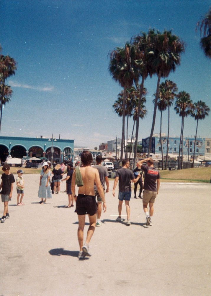 People walking around Venice Beach on a sunny day