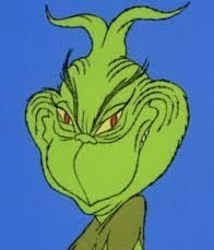 Picture from the animated Grinch movie of the Grinch smiling evilly