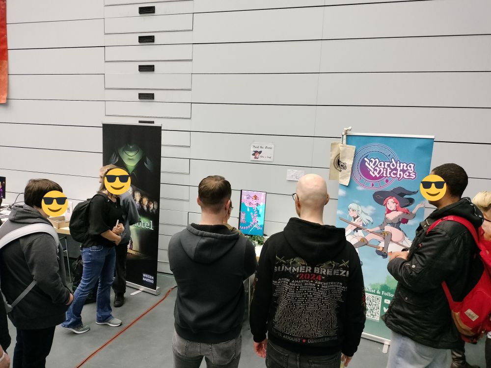 Several onlookers spectate Warding Witches being played