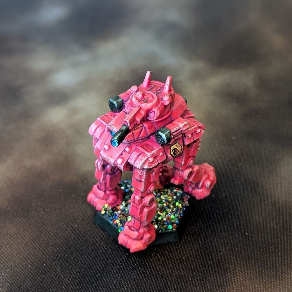 A Goliath mech for Battletech painted in bright pink paint and the base is glitter.