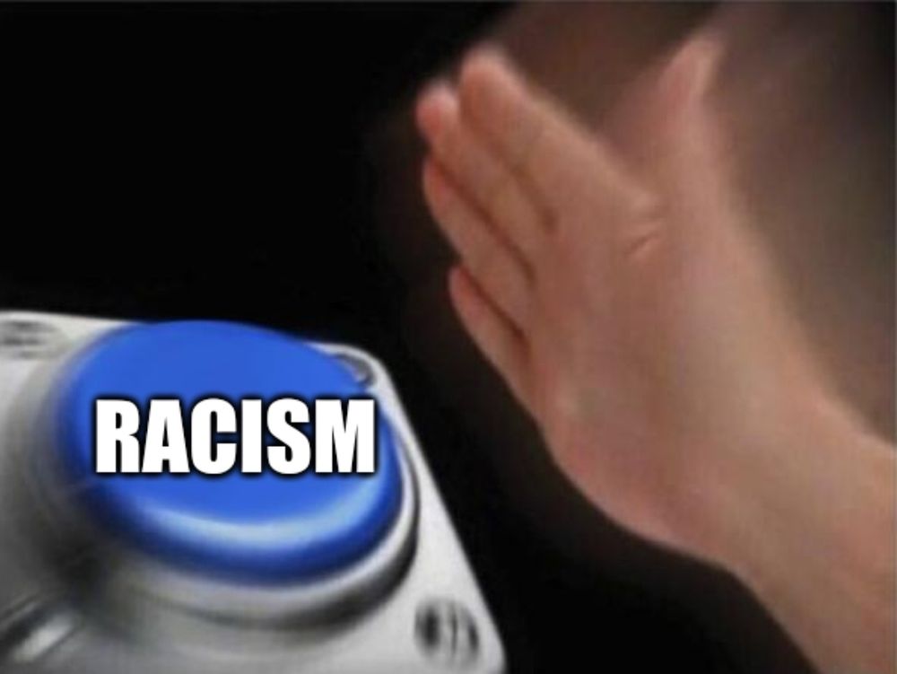 slamming a button labeled racism
