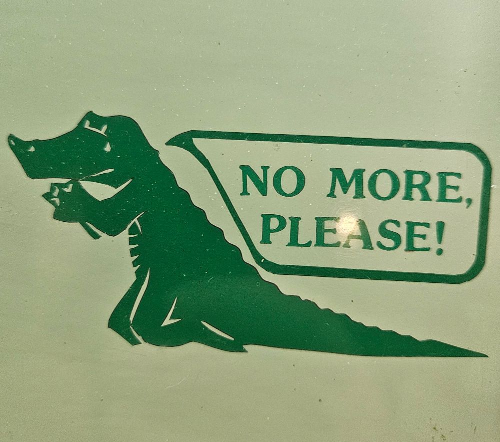 A drawing of a crying green gator on its knees, begging "No more, please!"
