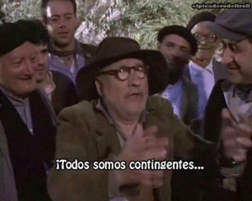 a man with glasses and a hat says " todos somos confinentes "