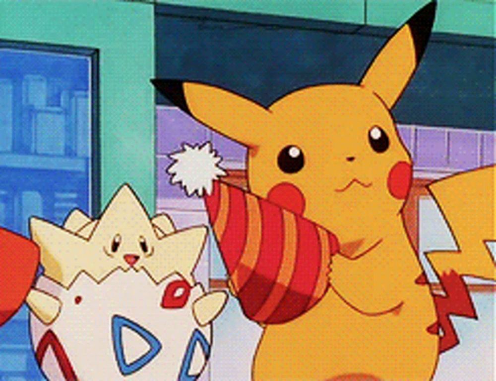 a pikachu holding a party hat next to a togey